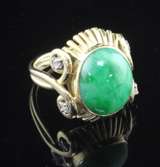 A 1950s Boucheron 18ct gold, cabochon jadeite and diamond oval dress ring, size L.
